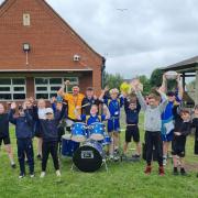 Pupils at Southfield Junior School after a music and sports session delivered by students from Highworth Warneford School