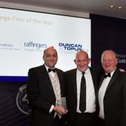 Partners Simon Tombs and Steve Fraser accepting the award for MHA Monahans