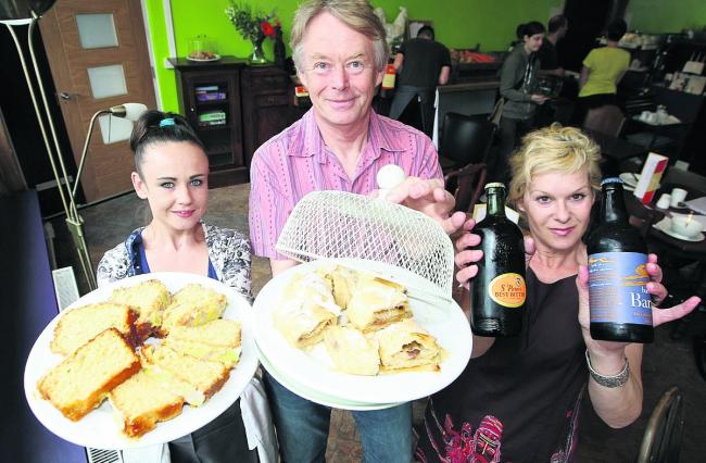 Going down a treat: Waitress Tanita Hickey and joint owners of the cafe David and Marya Marriott Picture: STUART HARRISON