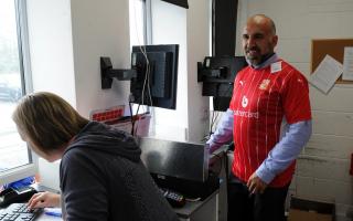 Swindon Town owner Clem Morfuni pictured selling season tickets - the Australian was also one of four people to receive a Trust STFC Hero Award this week	  Photo: Rob Noyes