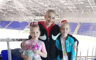 The Riasna sisters pictured with their coach -  (left to right) Anna Riasna (6) Swindon-born British Pairs Skating Champion Zoe Jones and Tetiana Riasna (7)