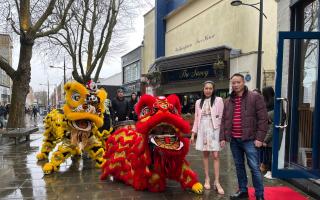 Hakka2 owner Christine Liaw welcomes the colourful lions into her restaurant to mark its grand opening.