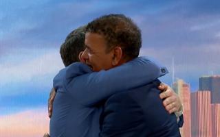 Chris Kamara and Ben Shepard embrace on Good Morning Britain.