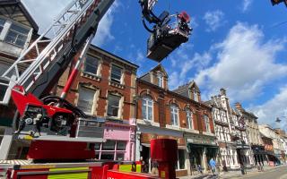Firefighters raise bunting on Wood Street