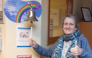 Olive Pryor ringing the bell after completing her cancer treatment in 2023