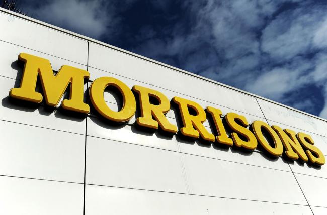 File photo dated 18/03/14 of a sign for Morrisons supermarket, as the supermarket chain revealed another big drop in sales as it grapples with an "intense" period of competition in the sector. PRESS ASSOCIATION Photo. Issue date: Thursday Novemb