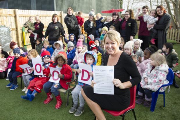 Manager Kate Adams with children, staff and parents at The Play Den. Picture: DAVE COX