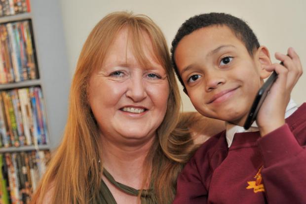 Dawn Ayim with her hero son Darion who called 999 when she collapsed at home Picture: Dave Cox