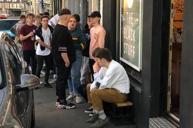 Youngsters queue to get into the yard sale