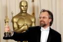 Jan A P Kaczmarek poses with the Oscar for best original score for his work on Finding Neverland during the 77th Academy Awards in February 2005 in Los Angeles (Reed Saxon/AP)