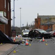The wreckage of a Honda Civic lies in the middle of Cricklade Road on Saturday morning after a crash overnight.