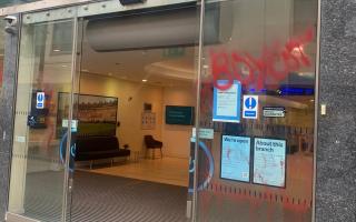 Graffiti on the windows of Barclays in Swindon town centre